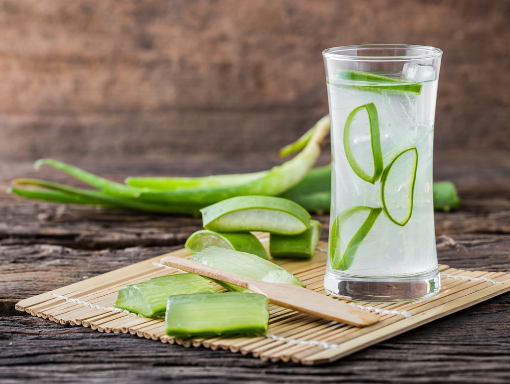 Aloe vera juice in a glass which helps in soothing the stomach pain