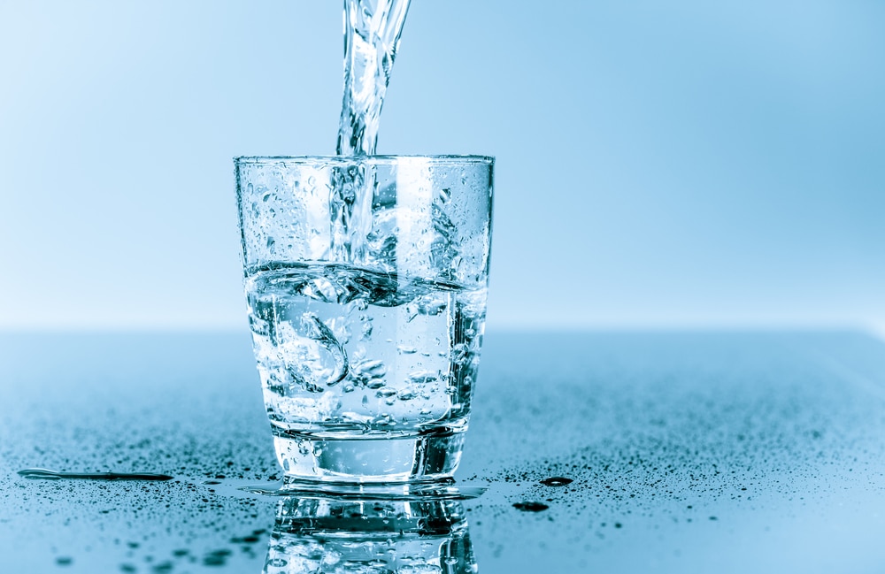 photo of a glass of water being poured which is one of the best home remedy for upset stomach